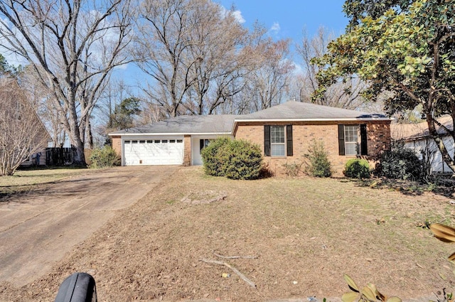 single story home with a garage, brick siding, fence, concrete driveway, and a front yard