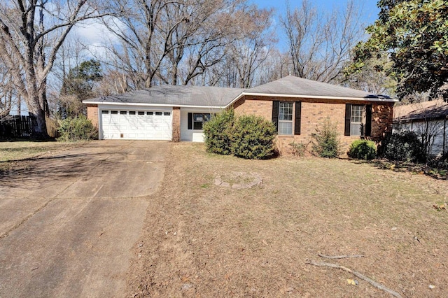 ranch-style house with a garage, a front lawn, concrete driveway, and brick siding