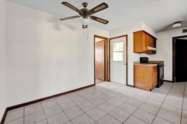 kitchen featuring ceiling fan, visible vents, baseboards, black electric range, and light countertops