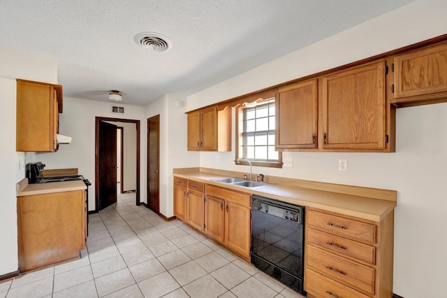 kitchen featuring light countertops, visible vents, brown cabinetry, a sink, and black appliances