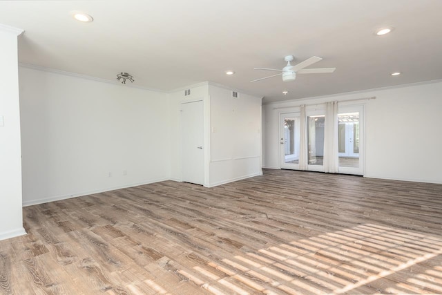 unfurnished room featuring ornamental molding, light wood-type flooring, and recessed lighting