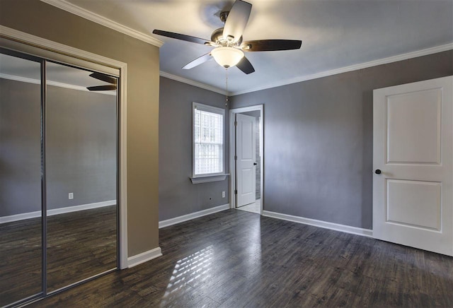 unfurnished bedroom with ceiling fan, crown molding, baseboards, and wood finished floors