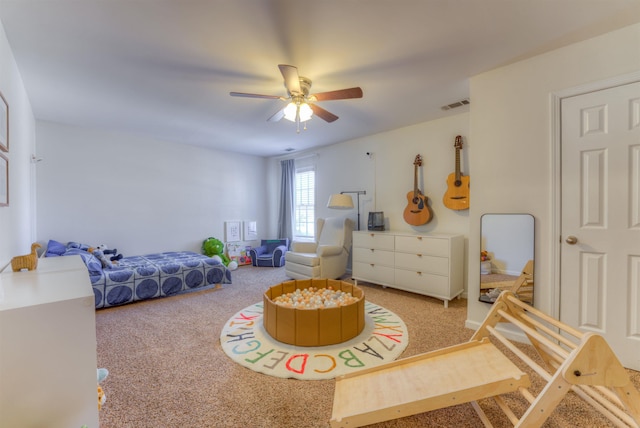 bedroom with a ceiling fan, carpet, and visible vents