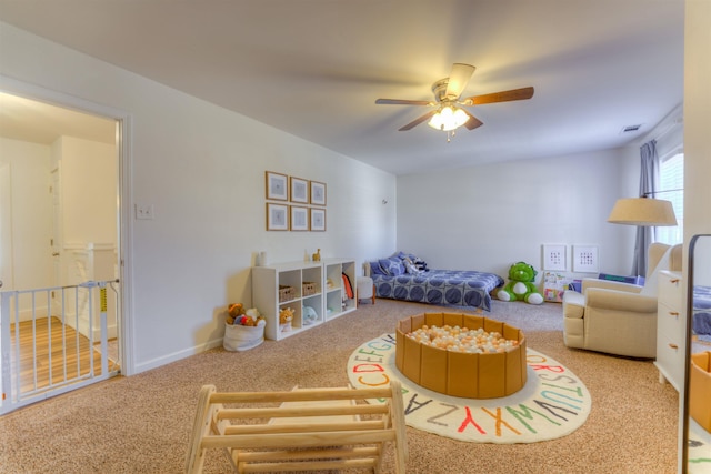 interior space with visible vents, ceiling fan, and baseboards