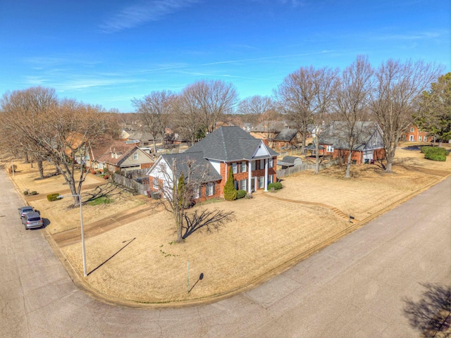 view of front of home featuring fence and a residential view