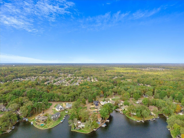 bird's eye view with a forest view and a water view