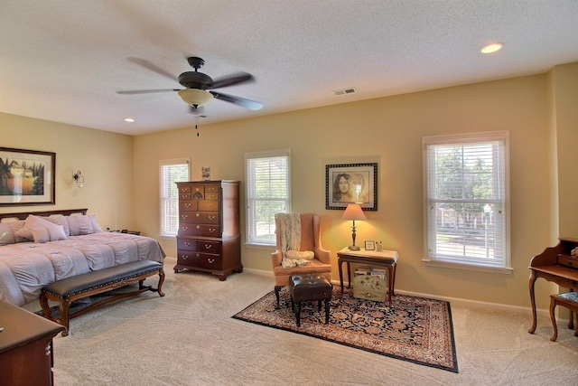 carpeted bedroom featuring visible vents, baseboards, a ceiling fan, a textured ceiling, and recessed lighting