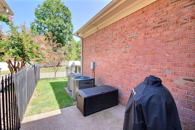 view of patio featuring a fenced backyard, a grill, and central air condition unit