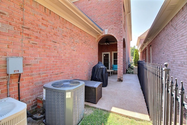 view of patio featuring ceiling fan and cooling unit