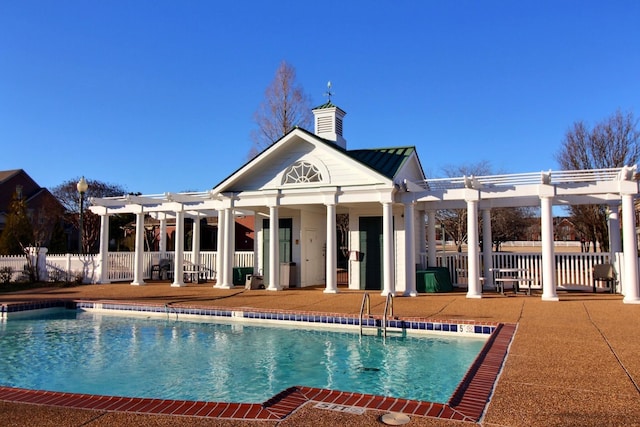 community pool featuring a patio, fence, and a pergola