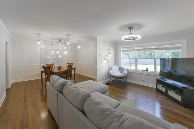 living area with crown molding, baseboards, and wood finished floors