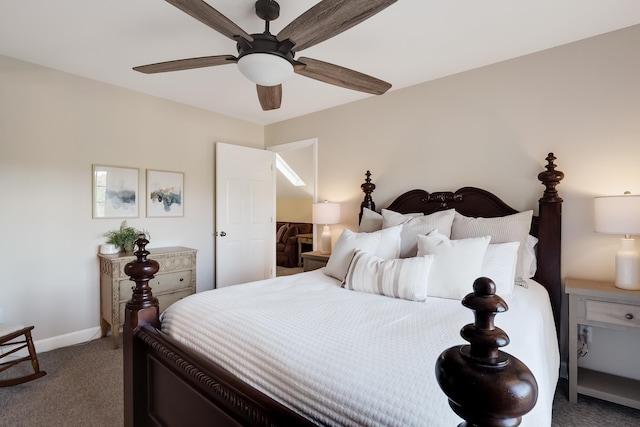 carpeted bedroom featuring ceiling fan and baseboards