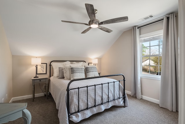 carpeted bedroom featuring lofted ceiling, baseboards, visible vents, and a ceiling fan