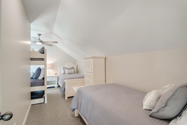 bedroom with lofted ceiling, carpet, a ceiling fan, and baseboards