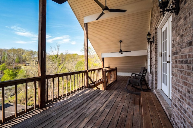 wooden deck featuring ceiling fan