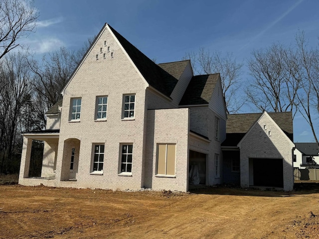 view of front of home with brick siding