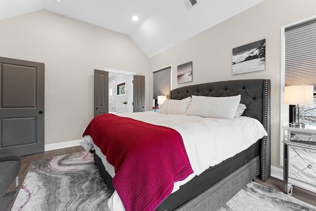 bedroom with visible vents, vaulted ceiling, baseboards, and wood finished floors