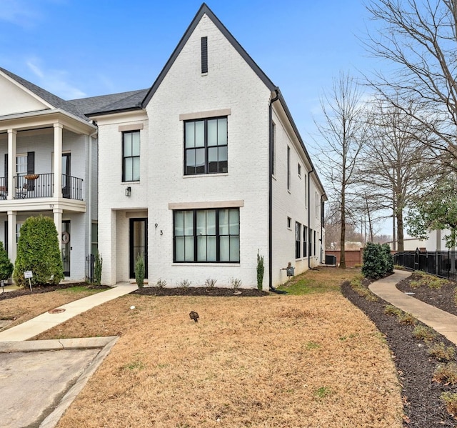 view of front of home featuring fence