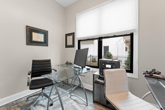 office featuring baseboards and wood finished floors