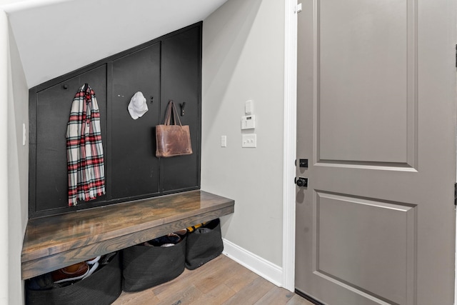 mudroom featuring baseboards and wood finished floors