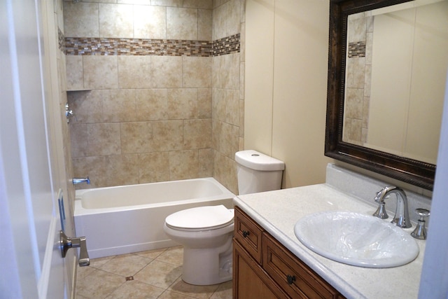 bathroom with tile patterned flooring, vanity, toilet, and shower / bathtub combination