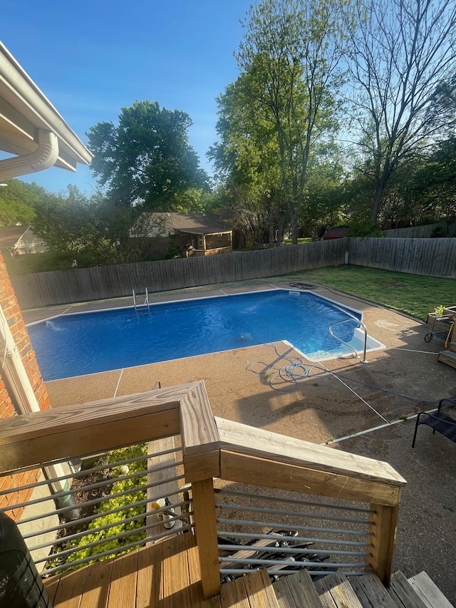 view of pool with a fenced backyard, a fenced in pool, and a patio