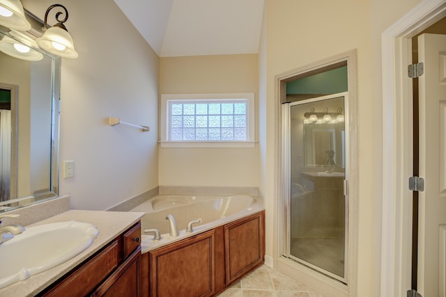 full bath with a stall shower, a garden tub, tile patterned flooring, vaulted ceiling, and vanity