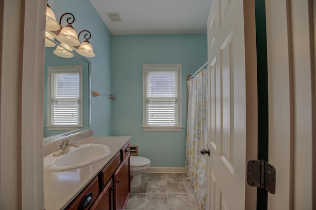 full bathroom with baseboards, visible vents, toilet, tile patterned flooring, and vanity