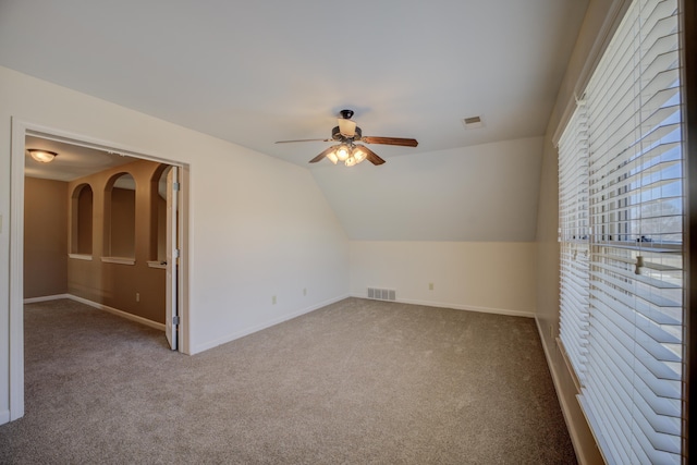 bonus room featuring a ceiling fan, carpet flooring, visible vents, and baseboards