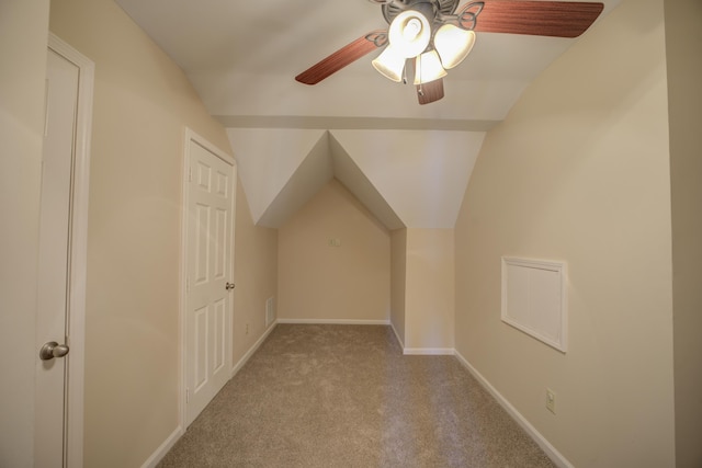 bonus room featuring lofted ceiling, carpet, baseboards, and a ceiling fan