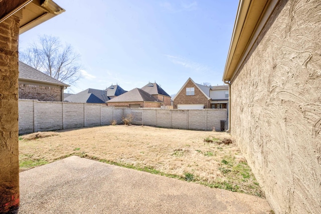 view of yard featuring a fenced backyard and a patio