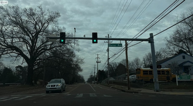 view of street with traffic lights and sidewalks