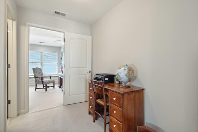 office with light carpet and visible vents