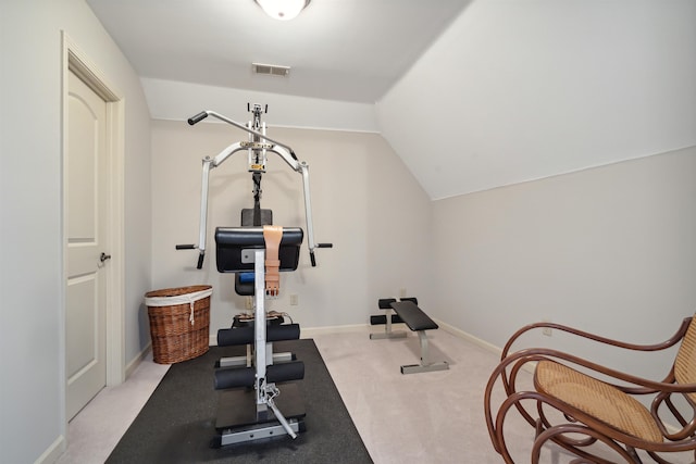 exercise room with lofted ceiling, carpet, visible vents, and baseboards