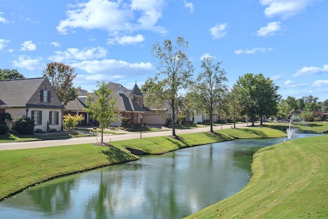 exterior space featuring a yard and a water view