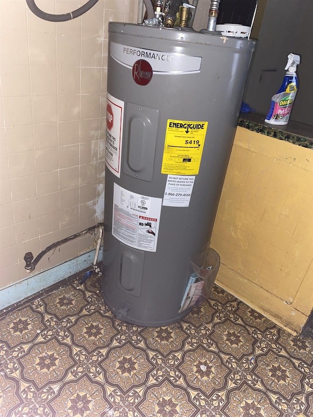 utility room featuring electric water heater