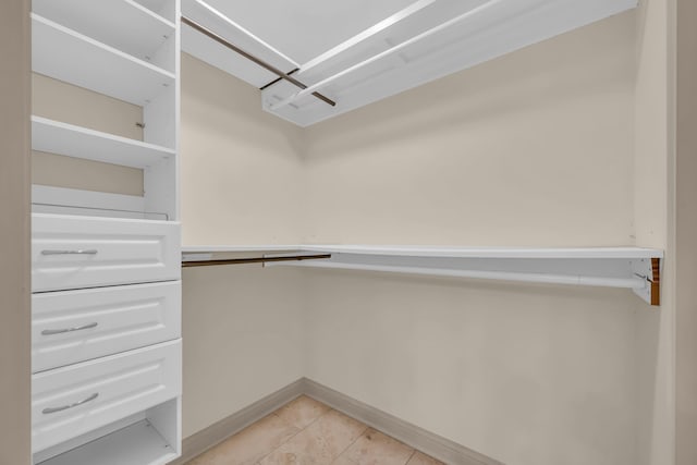 walk in closet featuring light tile patterned floors