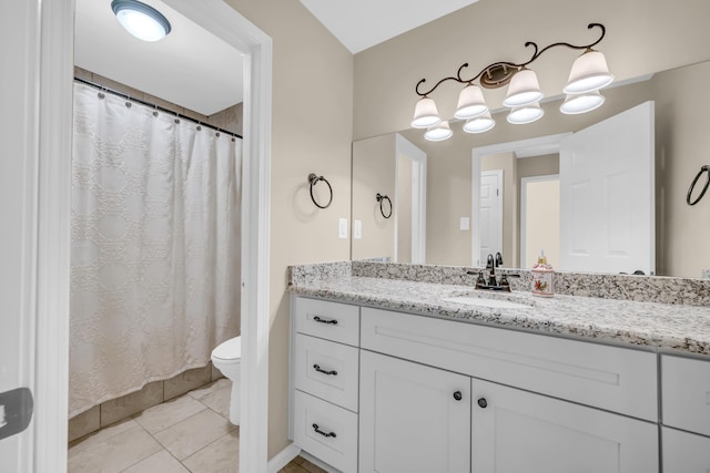 full bathroom featuring toilet, tile patterned flooring, and vanity