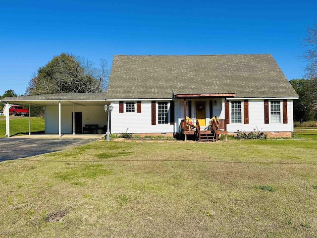 view of front facade featuring an attached carport, driveway, roof with shingles, crawl space, and a front yard