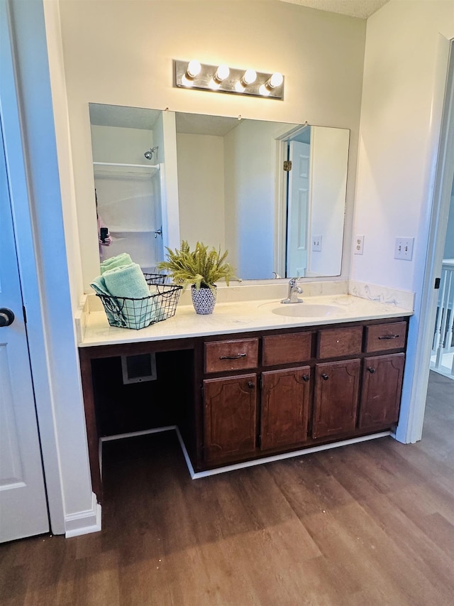 bathroom featuring vanity and wood finished floors