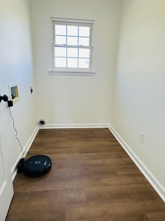 laundry area with hookup for an electric dryer, laundry area, dark wood-style flooring, washer hookup, and baseboards