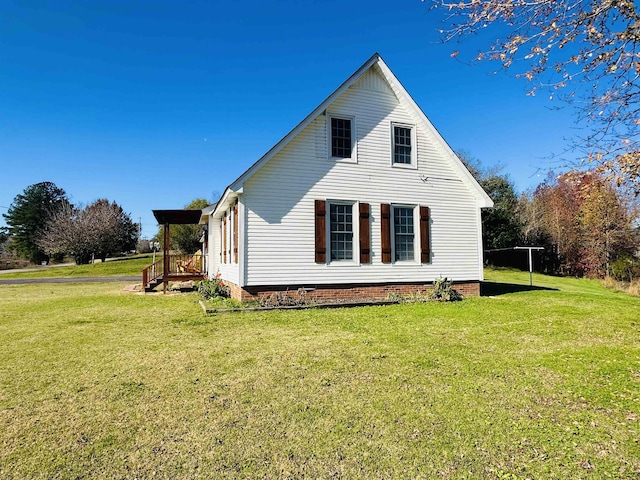 rear view of property with a lawn