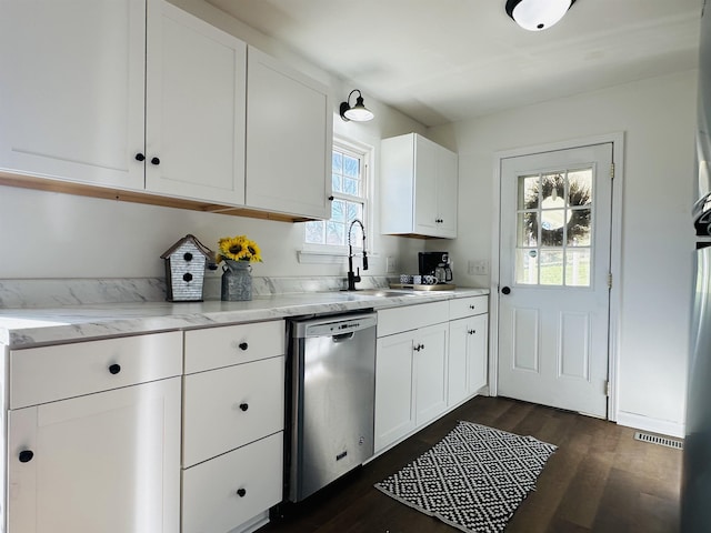 kitchen with dishwasher, light stone counters, dark wood finished floors, and white cabinetry