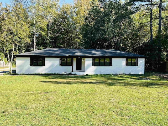 ranch-style house with a front yard