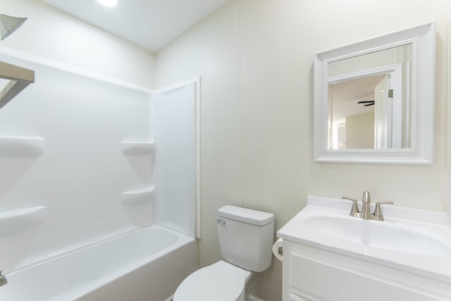 bathroom featuring shower / bathtub combination, vanity, and toilet