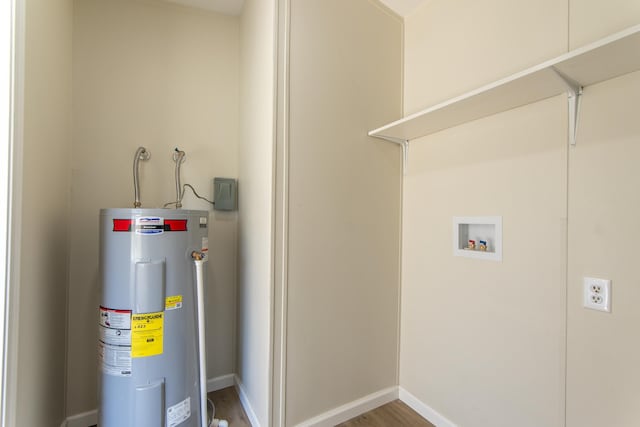 utility room featuring electric water heater