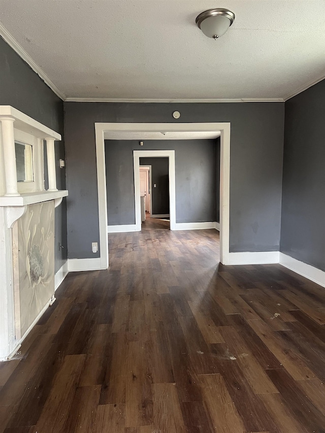 interior space with crown molding, baseboards, and wood finished floors