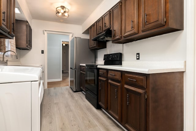 kitchen featuring black range with electric stovetop, light countertops, crown molding, light wood-type flooring, and under cabinet range hood