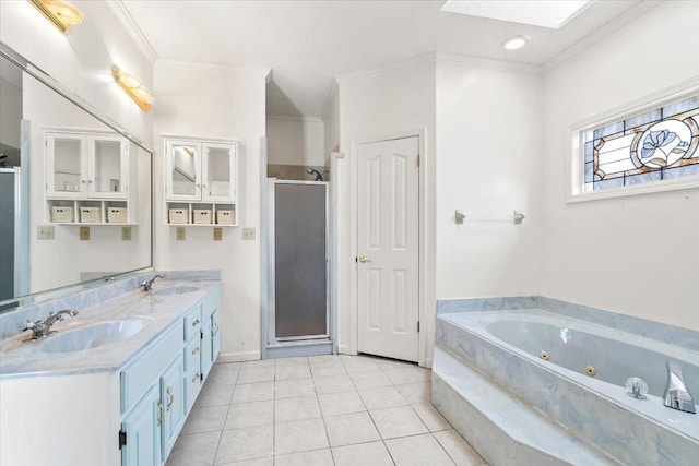 full bathroom featuring a stall shower, a skylight, a sink, and ornamental molding