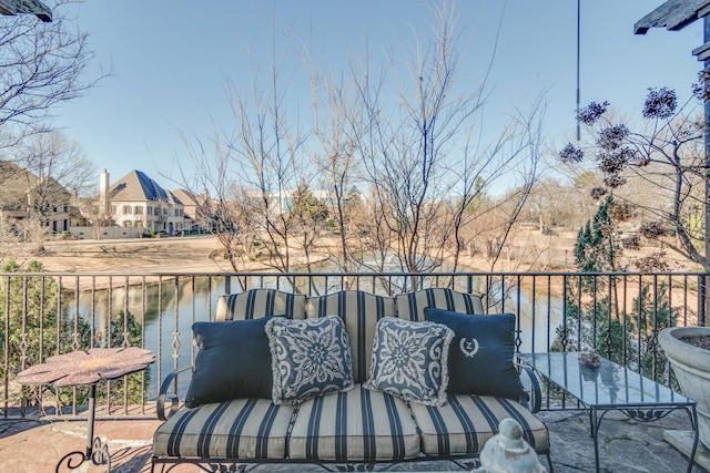 balcony featuring a water view